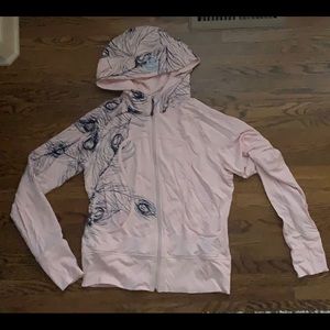 Lululemon zip up jacket with hood.